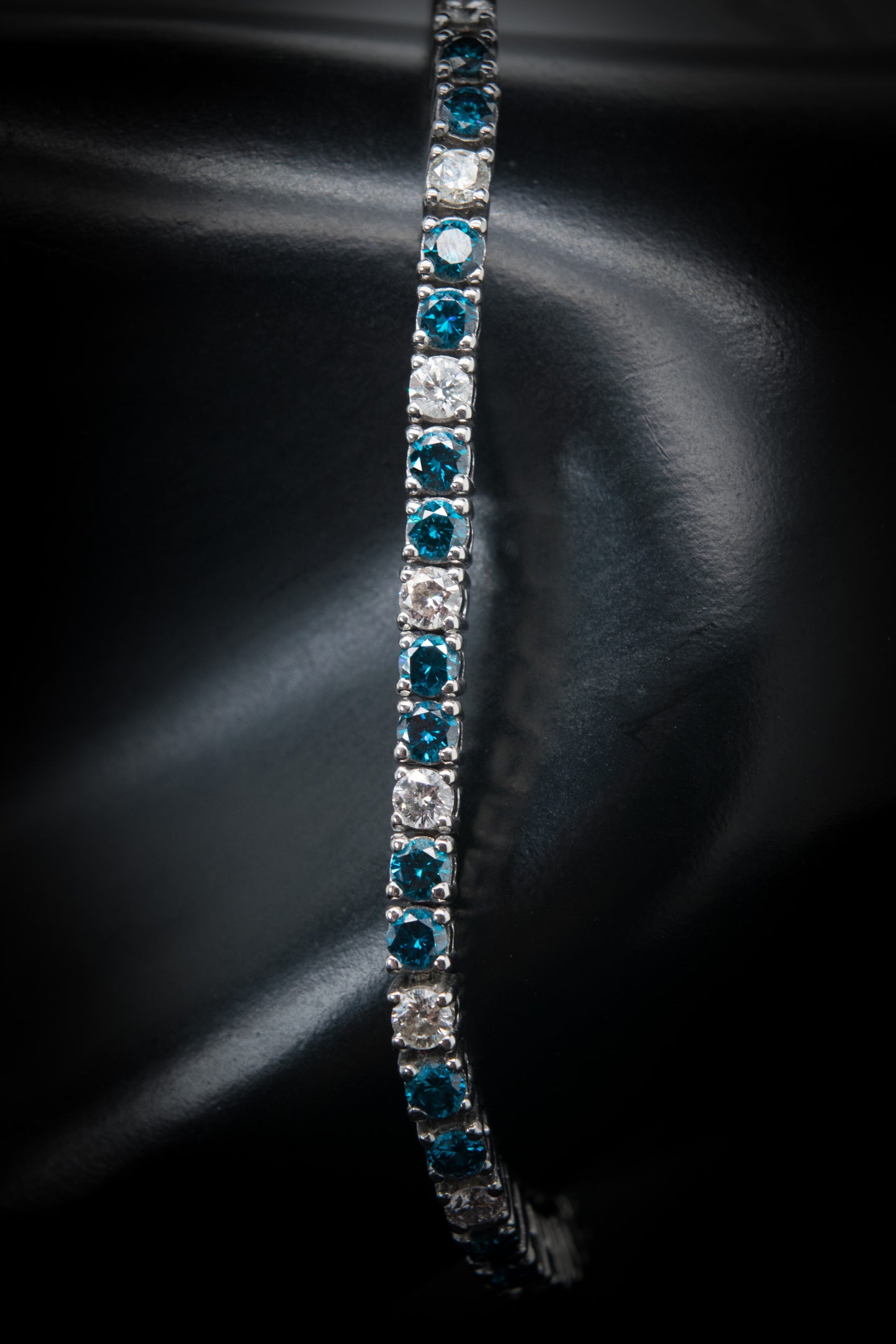 14kt WG Bracelet with White and Blue Diamond.